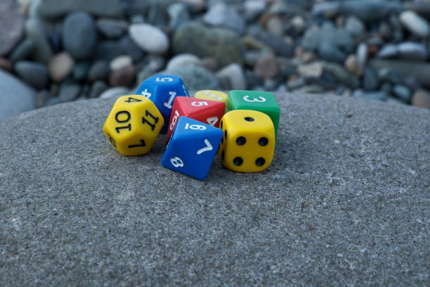 istock Colorful dice on the beach. Selective focus on dice. 2161904959