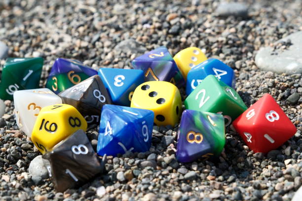 istock Colorful dice on the beach. Selective focus on dice. 2161905160