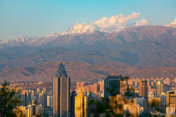 City skyline and Snow Mountains