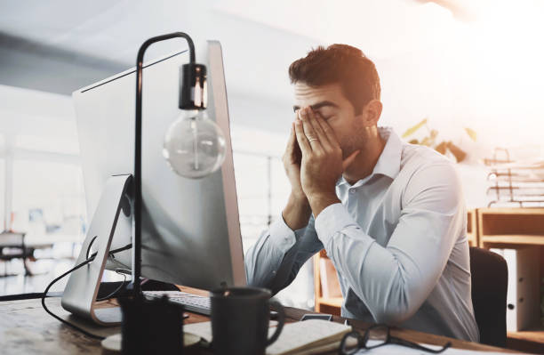 istock Burnout, stress and tired businessman in office on computer working on deadline, project and online report. Corporate demand, eye strain and exhausted database administrator with fatigue and pressure 2161917060