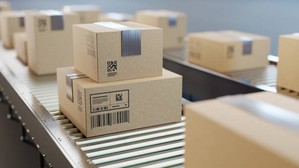 istock Automatic sorting, shipping and transportation concept. Packed boxes on the conveyor belt 2161917467