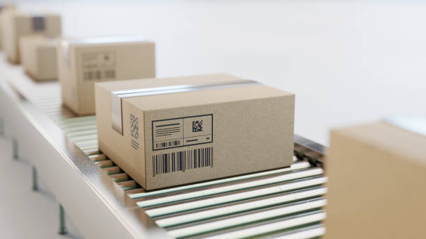 istock Automatic sorting, shipping and transportation concept. Packed boxes on the conveyor belt 2161917475