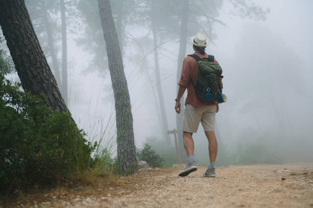 istock Hiker exploring foggy forest trail with backpack in scenic wilderness 2161919396