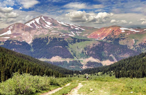 Mayflower Gulch Hiker on Colorado's Mayflower Gulch Trail near Leadville, with Jacques Peak in the background leadville stock pictures, royalty-free photos & images