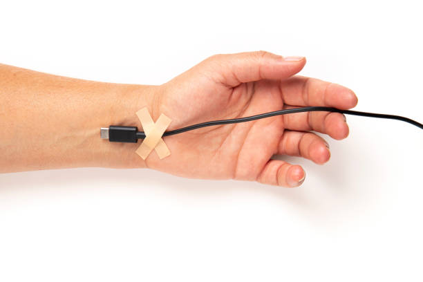 istock The USB charging cable plugged into the hand 2161922025