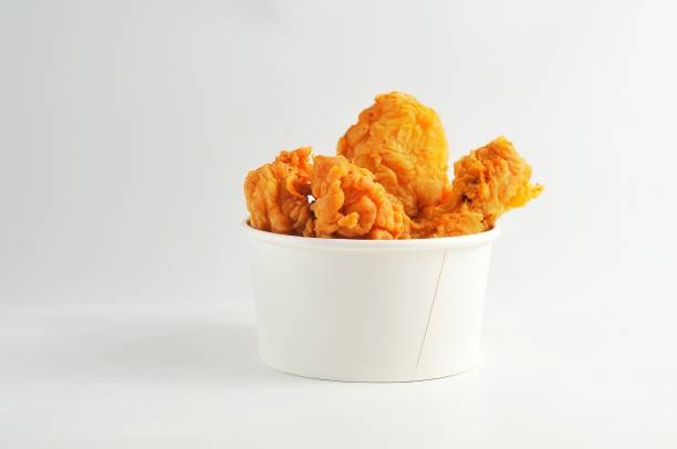 istock fried chicken in white bowl, isolated white background 2161922587