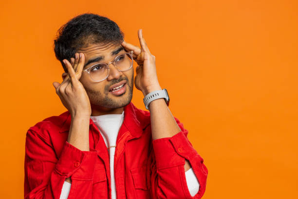 istock Indian man rubbing temples to cure headache problem, suffering from tension and migraine stress pain 2161927405