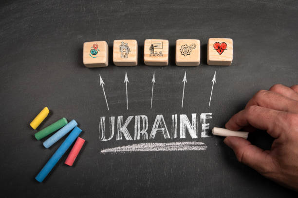 istock UKRAINE. WEooden blocks on a dark chalkboard background 2161930281