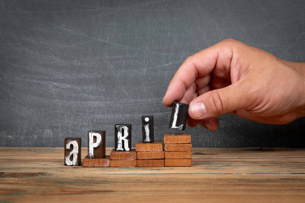 istock APRIL. Wooden letters, alphabet blocks on steps. development and growth concept 2161930282