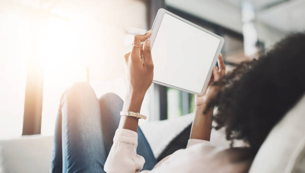 istock Black woman, sofa or website with tablet screen or mockup for internet research, reading lifestyle or blog for ideas. Female person, couch or ebook with relax for plan in home, scroll for information 2161930651