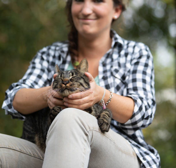 istock Woman with cat, both enjoying serene moment 2161930816