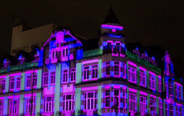 Schlemm Palace historic building facade with pink light projection using video mapping technology at the Festa Das Luzes Joinville 2024