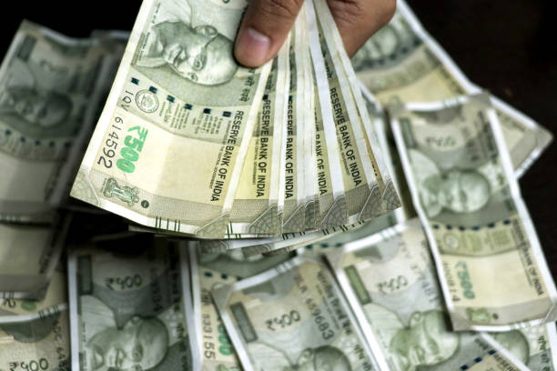 istock Hand holding Indian 500 Rupees bank note 2161940230