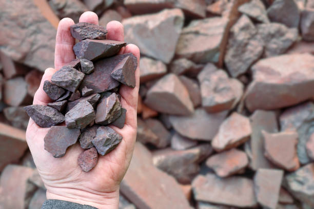 istock High grade (more than 63% Fe content) Australian iron ore, hematite (Fe2O3) held in hand. Blast furnaces feed for iron-making. 2161944559