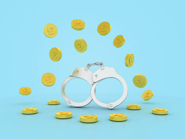 istock 3D Handcuffs with Pounds Coins 2161946695