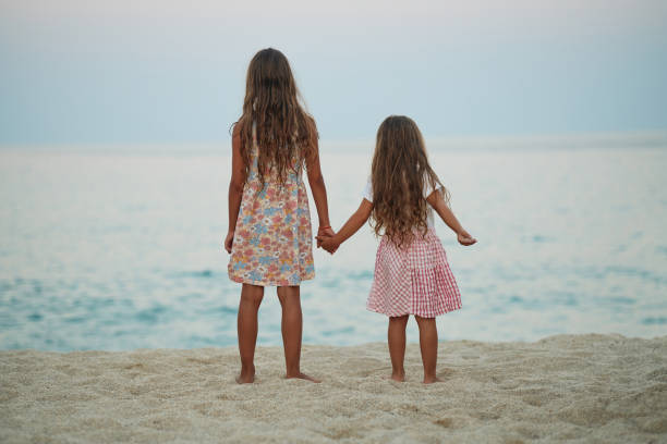 istock Beautiful sisters enjoying summer vacation 2161948916