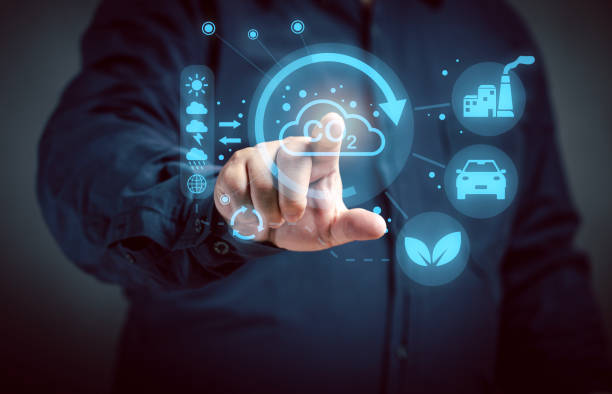 istock Man points at virtual screen with Carbon Zero image critical weather conditions Greenhouse effect, co2 emissions, climate change. Pollution global factory carbon dioxide and gas. 2161954041
