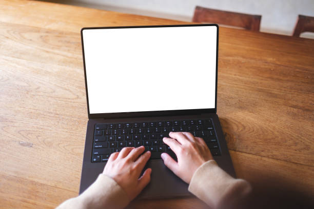 istock Mockup image of a woman working and typing on laptop computer with blank white desktop screen 2161956745