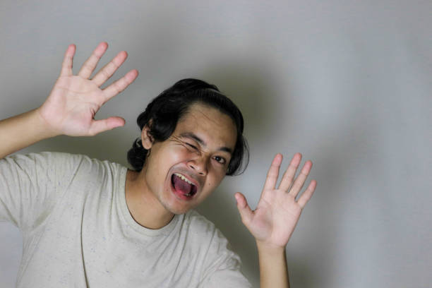expression of a handsome Indonesian man with isolated white background