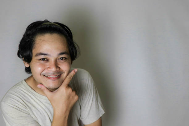 expression of a handsome Indonesian man with isolated white background