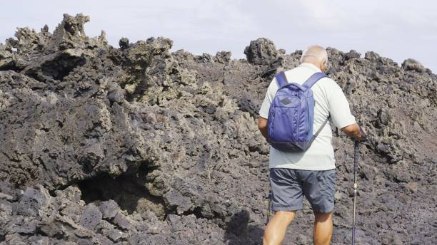 istock The man walks alone on the volcanic island 2161958133