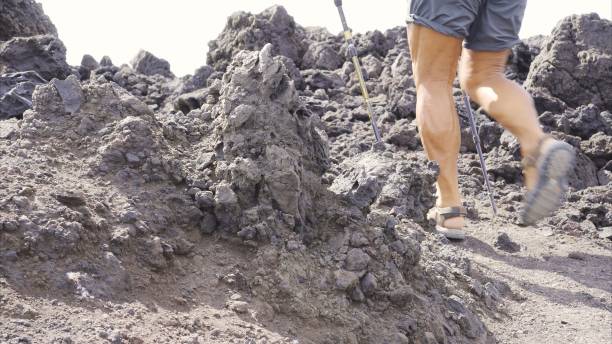 istock Elderly Strength: Muscular Legs Among Lava Rocks 2161958152