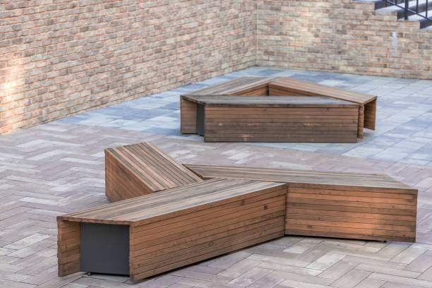 istock modern yard space paved floor brick wall fenced landscaped space with designed wooden bench square shape no people here 2161958310