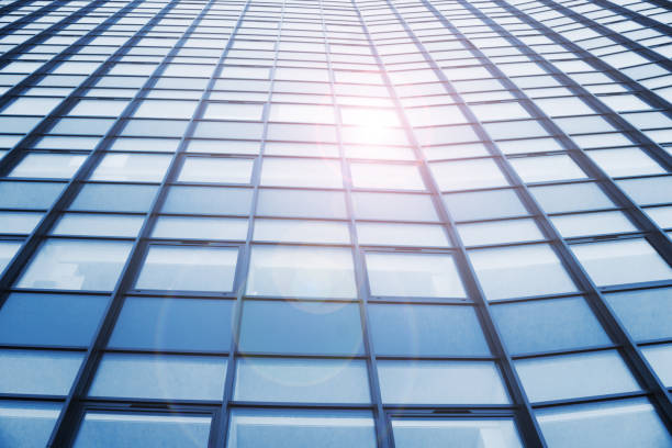 Window sunlight reflection. Bright warm sunbeam on cold glass.