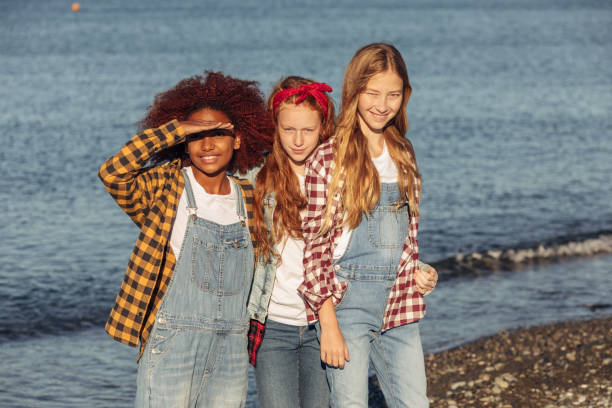 istock Three young girls relaxing on the beach 2161959660