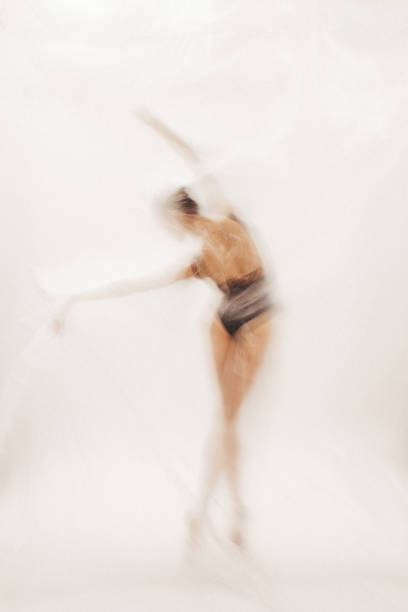 istock Beautiful ballerina dancing on the stage 2161960008