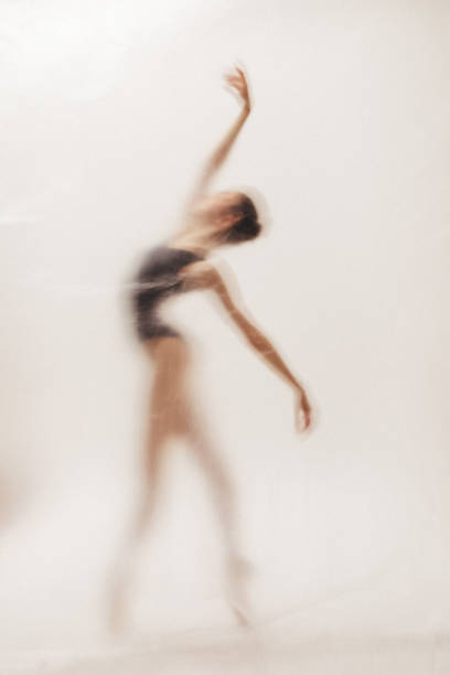 istock Beautiful ballerina dancing on the stage 2161960114