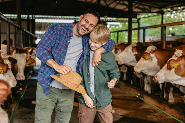 istock Father and Son Bonding at Organic Cattle Farm 2161960802