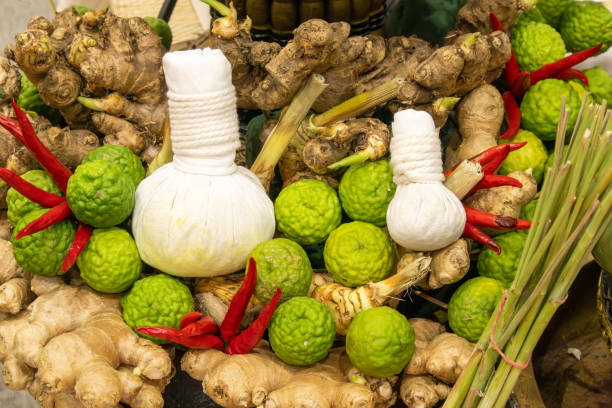 Thai herbs include kaffir lime, turmeric, ginger, and dried bael fruit for health care.