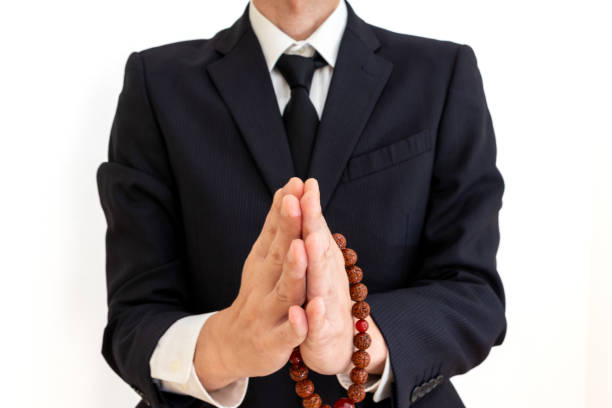 istock A man praying with prayer beads in his hands 2161961632