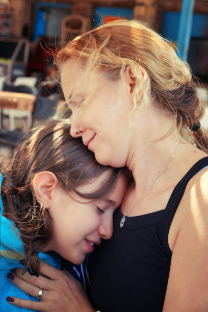 istock Mother and Daughter Hug with Love 2161962840
