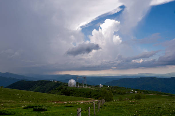 Large observatory dome with a metal crane structure. BTA 6. Large Azimuth Telescope. View of Astrophysical observatory of Russian Academy of Sciences. Caucasus Scenic landscape