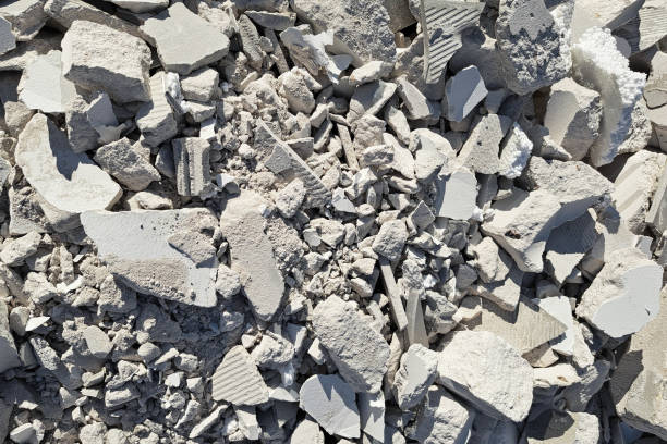 istock Post-renovation debris: concrete, brick, and gypsum fragments create a dusty texture. Chaotic scene of broken materials and construction waste. 2161970059