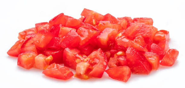istock Peeled and diced fresh tomatoes isolated on white background. Macro shot. 2161970395