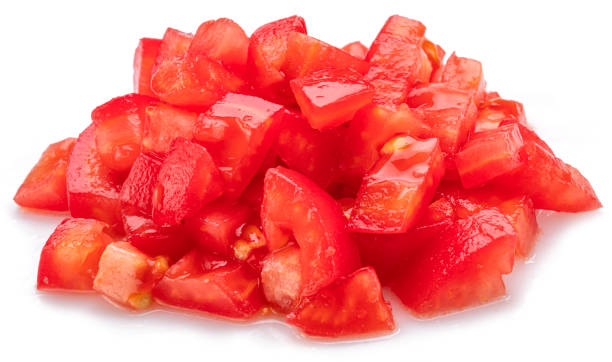 istock Peeled and diced fresh tomatoes isolated on white background. Macro shot. 2161970404