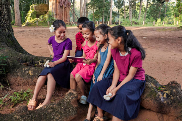 istock Cambodian children using digital tablet in village, Cambodia 2161972066