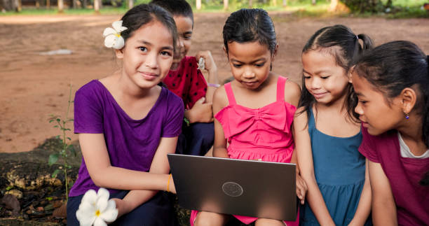 istock Cambodian children using laptop in village, Cambodia 2161972072