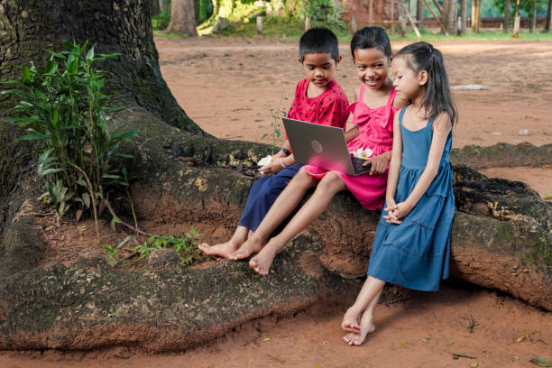 istock Cambodian children using digital tablet in village, Cambodia 2161972077
