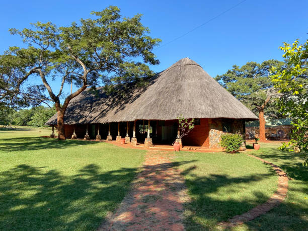 Harare, Zimbabwe - April 24 2024: Thatched roof building at Harare Botanical Gardens