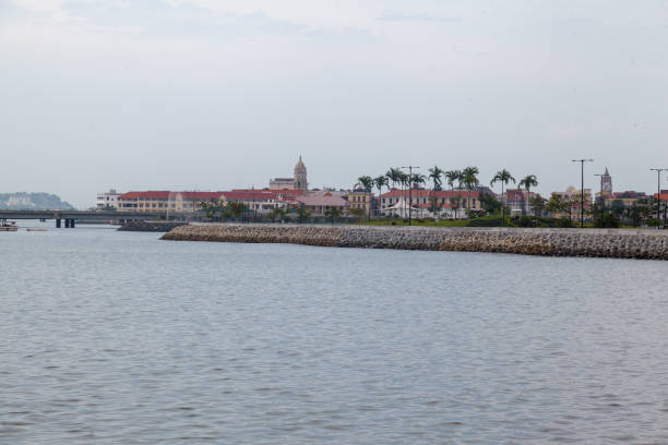 Historical buidlings in Old Town (Casco Viejo) of Panama City at the shore of the gulf of Panama. Palacio Bolivar and San Francis of Assisi Church tower.