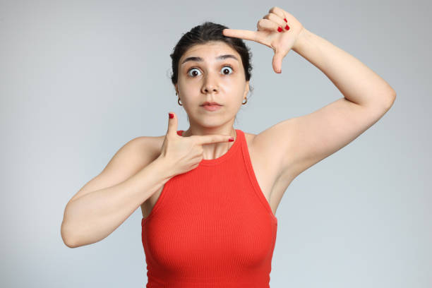 istock Young girl makes a framing gesture to the camera 2161973070