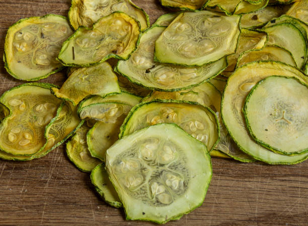 istock Dried zucchini slices on a wooden board 2161973354