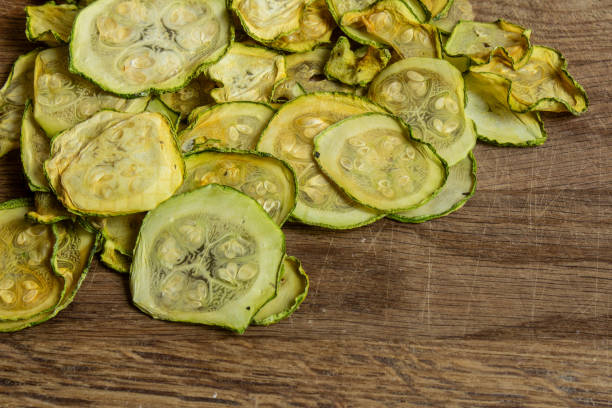 istock Dried zucchini slices on a wooden board 2161973366
