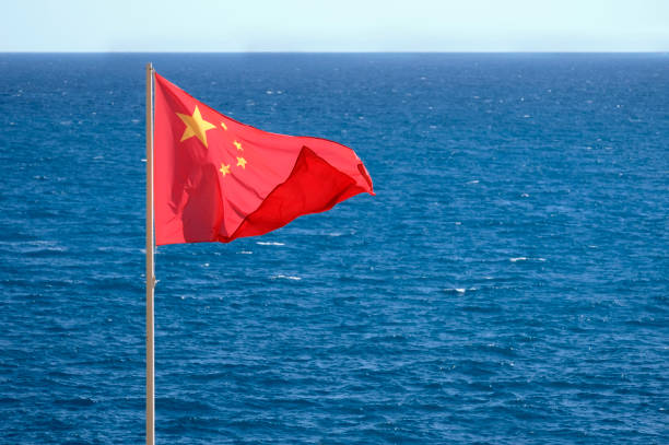 Chinese national flag at the coast near the sea