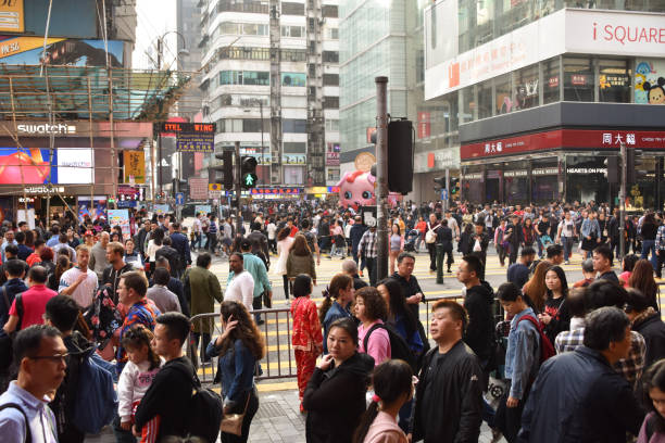Hong Kong, China - February 5, 2019: A busy intersection in Hong Kong with a large crowd of people during the Lunar New Year.