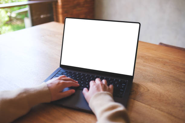 istock Mockup image of a woman working and typing on laptop computer with blank white desktop screen 2161975873